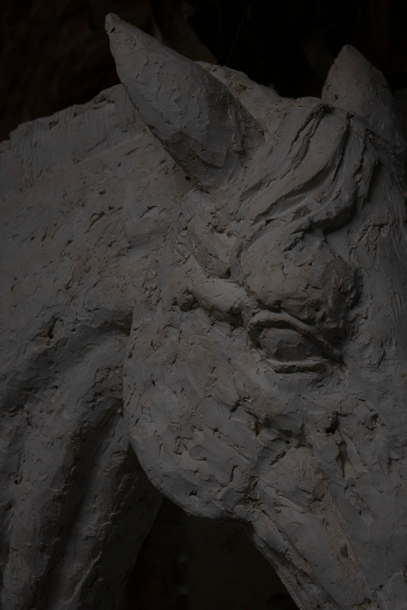 Sculpted clay figure detail, studio